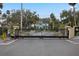 Gated entrance to a community featuring a large teal house at 633 S Palmetto Ave # 1010, Daytona Beach, FL 32114