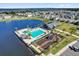 Community pool on the water features a splash pad, cabana, playground, and ample seating for relaxing by the water at 635 Belgrove St, Debary, FL 32713