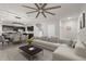 Open-concept living room featuring modern furniture and ample natural light adjacent to dining area and kitchen at 635 Belgrove St, Debary, FL 32713