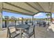Covered outdoor patio area overlooking a tranquil lake, perfect for outdoor dining and relaxation at 635 Belgrove St, Debary, FL 32713