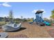 A vibrant community playground featuring a climbing structure, slides, and a boat on mulch ground at 635 Belgrove St, Debary, FL 32713