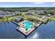 Community pool on the water features a splash pad, cabana, playground, and ample seating for relaxing by the water at 635 Belgrove St, Debary, FL 32713