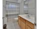 Bathroom featuring a shower with gray striped curtain and vanity at 955 N Ridgewood Ave, Deland, FL 32720