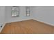 Empty bedroom with laminate flooring and bright natural light from the windows at 955 N Ridgewood Ave, Deland, FL 32720