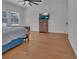 Spacious bedroom featuring hardwood floors and a ceiling fan at 955 N Ridgewood Ave, Deland, FL 32720