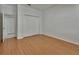 Bedroom with hardwood floors and closet with bi-fold doors at 955 N Ridgewood Ave, Deland, FL 32720