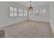 Bright dining area featuring modern lighting and ample natural light from shuttered windows at 955 N Ridgewood Ave, Deland, FL 32720