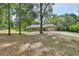 Beautiful home with stone accents, a two-car garage, and a well-manicured lawn at 955 N Ridgewood Ave, Deland, FL 32720