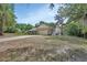 Spacious home with an attached two-car garage and a long driveway at 955 N Ridgewood Ave, Deland, FL 32720