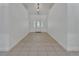 Bright foyer with tile flooring, high ceilings, and a decorative front door at 955 N Ridgewood Ave, Deland, FL 32720