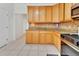 Bright kitchen with wood cabinets, granite countertops, and stainless steel appliances at 955 N Ridgewood Ave, Deland, FL 32720