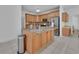 Well-equipped kitchen boasts granite countertops, stainless steel appliances, and custom cabinets at 955 N Ridgewood Ave, Deland, FL 32720