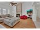 Cozy living room showcases a stone fireplace, vaulted ceiling, and stylish furnishings at 955 N Ridgewood Ave, Deland, FL 32720