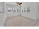 Bright sunroom with multiple windows and tile flooring at 955 N Ridgewood Ave, Deland, FL 32720