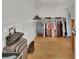 Walk-in closet with custom shelving, hanging racks, and ample storage space at 955 N Ridgewood Ave, Deland, FL 32720
