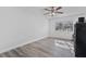 Bright bedroom with wood-look floors and large window at 1101 18Th St, Orange City, FL 32763