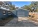 Detached garage with metal siding and roll-up door at 1101 18Th St, Orange City, FL 32763