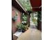 Cozy patio with hanging plants and gate leading to a walkway at 115 Cypress Pond Rd, Port Orange, FL 32128