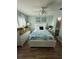Charming bedroom featuring a full-size bed and ample natural lighting at 115 Cypress Pond Rd, Port Orange, FL 32128