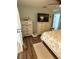 Bedroom with dresser, king bed and TV at 115 Cypress Pond Rd, Port Orange, FL 32128