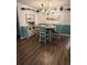 Bright dining area with wood floors and chandelier at 115 Cypress Pond Rd, Port Orange, FL 32128