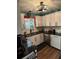 Modern kitchen with white cabinets and granite counters at 115 Cypress Pond Rd, Port Orange, FL 32128