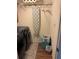 Efficient laundry room with a washer, dryer, and ironing board at 115 Cypress Pond Rd, Port Orange, FL 32128