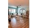 Open living room with sectional sofa and wood floors at 115 Cypress Pond Rd, Port Orange, FL 32128