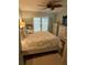 Inviting main bedroom with a queen-sized bed and access to the outdoors at 115 Cypress Pond Rd, Port Orange, FL 32128