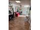 Home office with hardwood floors, red couch and work desk at 115 Cypress Pond Rd, Port Orange, FL 32128