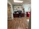 Home office with hardwood floors and built-in desk and shelving at 115 Cypress Pond Rd, Port Orange, FL 32128