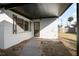 Covered back patio with walkway leading to a storage shed at 1208 N Boston Ave, Deland, FL 32724