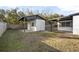 View of backyard with shed and covered patio area at 1208 N Boston Ave, Deland, FL 32724