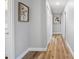 Bright hallway with hardwood floors and neutral wall paint at 1208 N Boston Ave, Deland, FL 32724