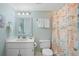 Bathroom with shower, toilet, and vanity at 1513 Ocean Shore Blvd # 2B, Ormond Beach, FL 32176