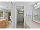 Bathroom features double sinks, a vanity, and a walk-in shower at 1513 Ocean Shore Blvd # 2B, Ormond Beach, FL 32176