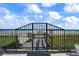 Beach access through a private gate with boardwalk and bench at 1513 Ocean Shore Blvd # 2B, Ormond Beach, FL 32176