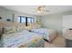 Guest bedroom with two twin beds and ocean view at 1513 Ocean Shore Blvd # 2B, Ormond Beach, FL 32176