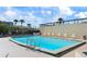 Refreshing community pool with lounge chairs for relaxation at 1513 Ocean Shore Blvd # 2B, Ormond Beach, FL 32176