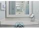Bright vanity area with a mirror and a small chair at 1513 Ocean Shore Blvd # 2B, Ormond Beach, FL 32176