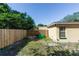 A fenced backyard with lawn at 1649 W Waycross Cir, Deltona, FL 32725