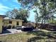 Well-maintained backyard with patio, lounge area, and lush landscaping at 1649 W Waycross Cir, Deltona, FL 32725