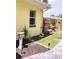 Landscaped backyard featuring a bird bath, wooden fence, solar lights, and walkway pavers at 1649 W Waycross Cir, Deltona, FL 32725