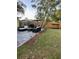 Backyard patio with ample seating, outdoor furniture, a grill, and a relaxing swing at 1649 W Waycross Cir, Deltona, FL 32725