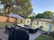 Spacious backyard patio with stylish outdoor furniture and ample seating, perfect for entertaining at 1649 W Waycross Cir, Deltona, FL 32725