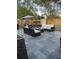 Relaxing backyard patio area with comfortable seating, dining area, and outdoor grill at 1649 W Waycross Cir, Deltona, FL 32725