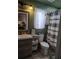 The bathroom features a tiled floor, a sink with vanity storage, and a shower-tub combo at 1649 W Waycross Cir, Deltona, FL 32725