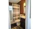 Bathroom features a shower/tub combo with brown and white striped shower curtain at 1649 W Waycross Cir, Deltona, FL 32725