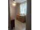 Cozy bedroom with neutral walls, ceiling fan, and dresser by window at 1649 W Waycross Cir, Deltona, FL 32725