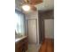 Cozy bedroom featuring a ceiling fan, closet, and natural light from the window at 1649 W Waycross Cir, Deltona, FL 32725